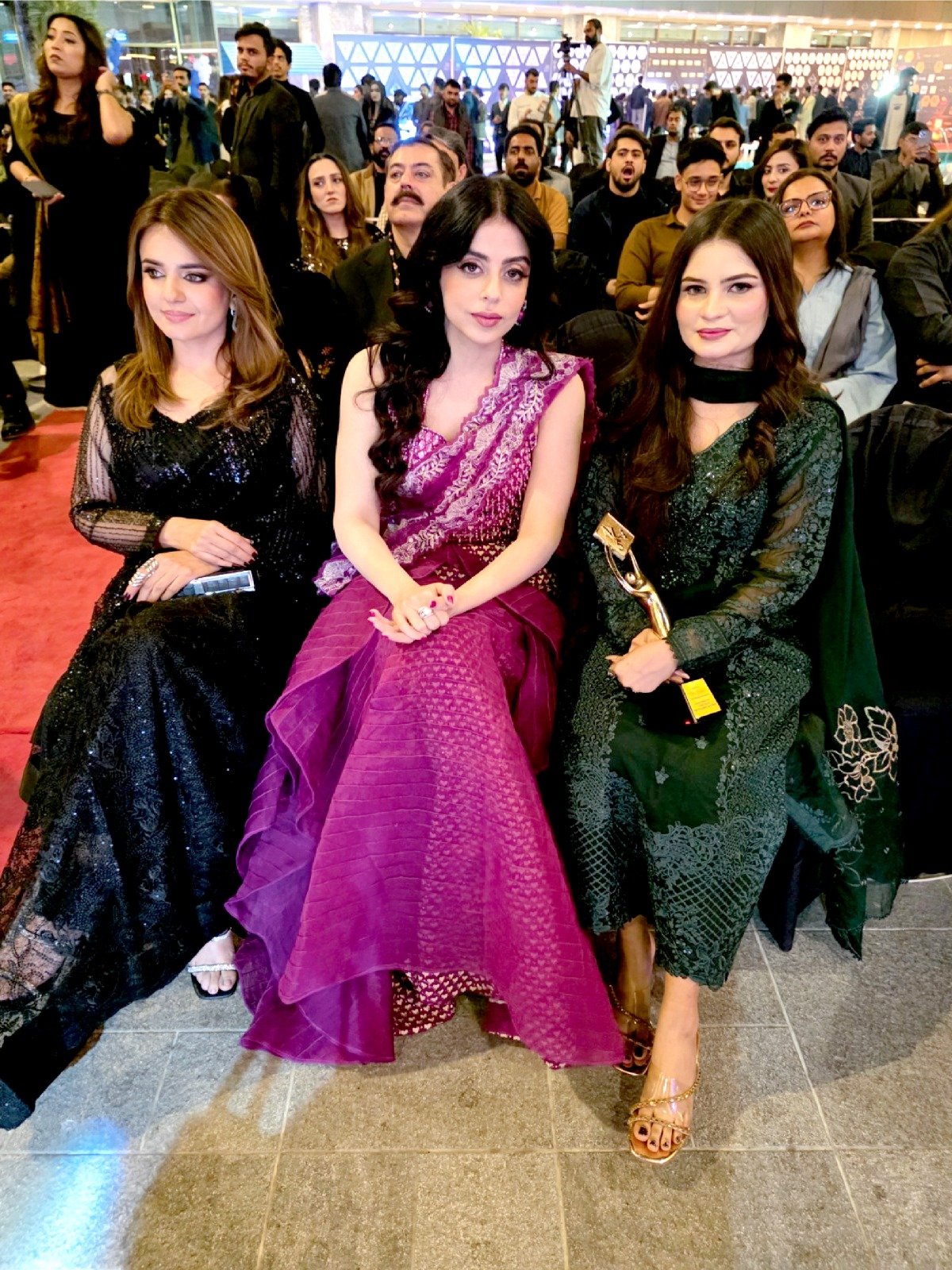 CEO Mrs. Mughal seated alongside prominent media personalities and guests