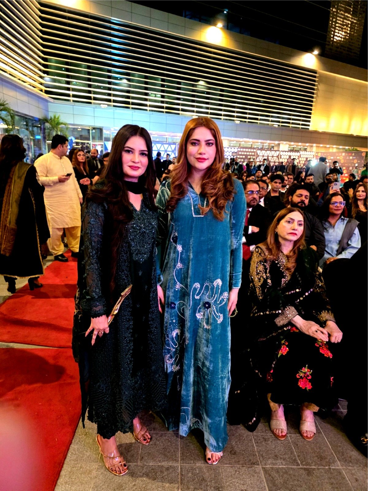 CEO Mrs. Mughal at the outdoor Red Carpet gala with guests