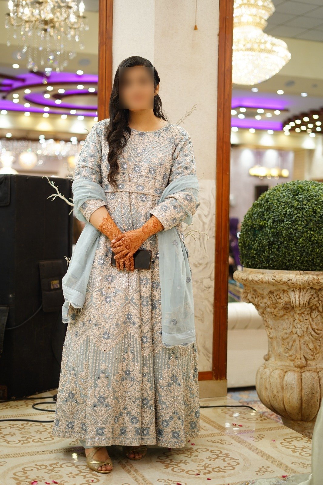 Graceful bride dressed in embroidered pastels for her matrimonial celebration